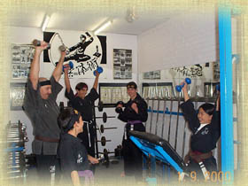 Juniors undergoing light weight exercises