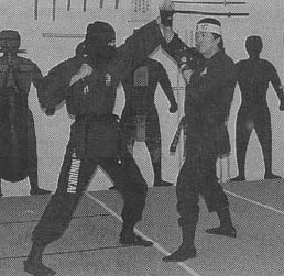 Shihan demonstrating a blocking technique