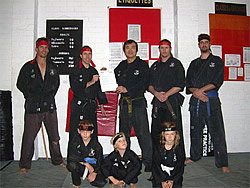 Sensei Paul, Shihan John Ang and members with Grant Certificate Sensei Paul, Shihan John Ang and members with Grant Certificate